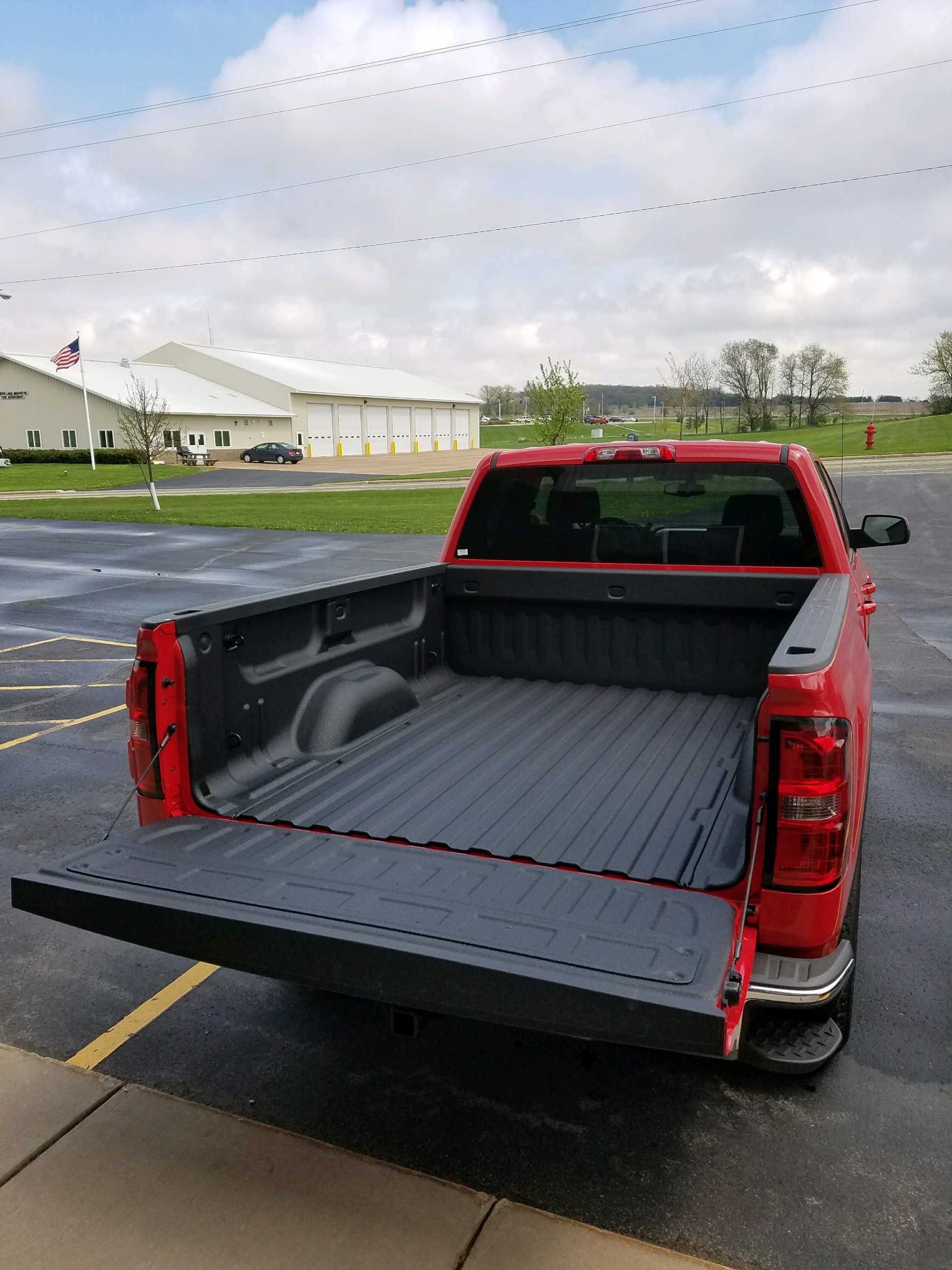 Pickup truck with sprayed bed liner and underbody rust coating